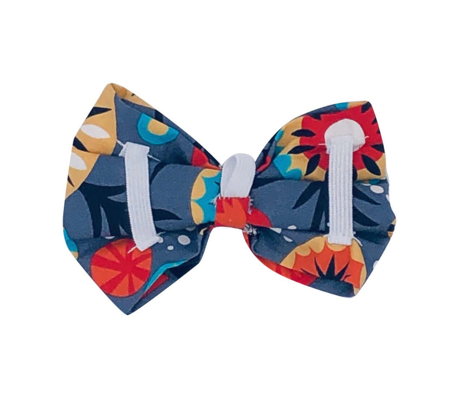 Colorful Pop Bow tie with floral patterns, designed for dogs, easily attaches to collars, made in the USA.