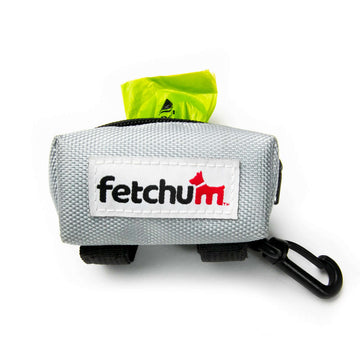 Leash Attachment Poop Bag Holder in gray featuring a bright green poop bag and a clip for leashes.