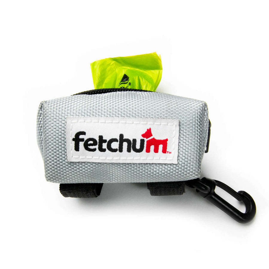 Leash Attachment Poop Bag Holder in gray featuring a bright green poop bag and a clip for leashes.