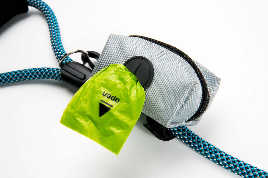 Leash Attachment Poop Bag Holder with green poop bag visible, designed for quick access and convenience.