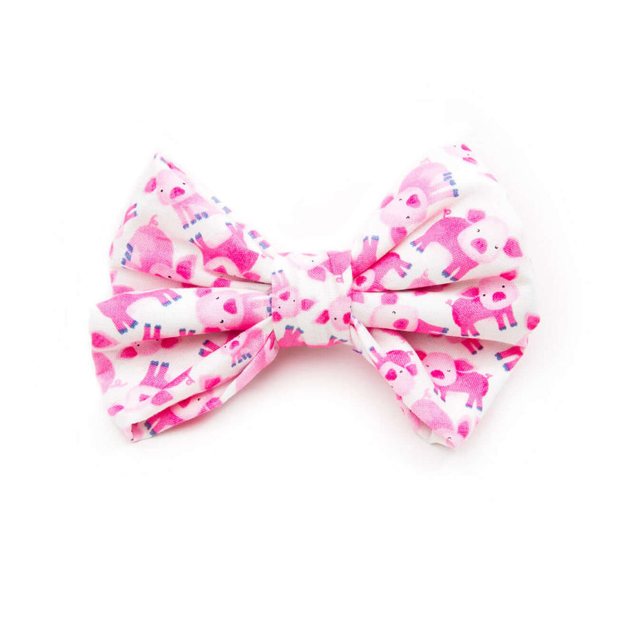 Pink Piglets Bowtie in pink and white fabric featuring adorable piglet patterns for dogs' collars.