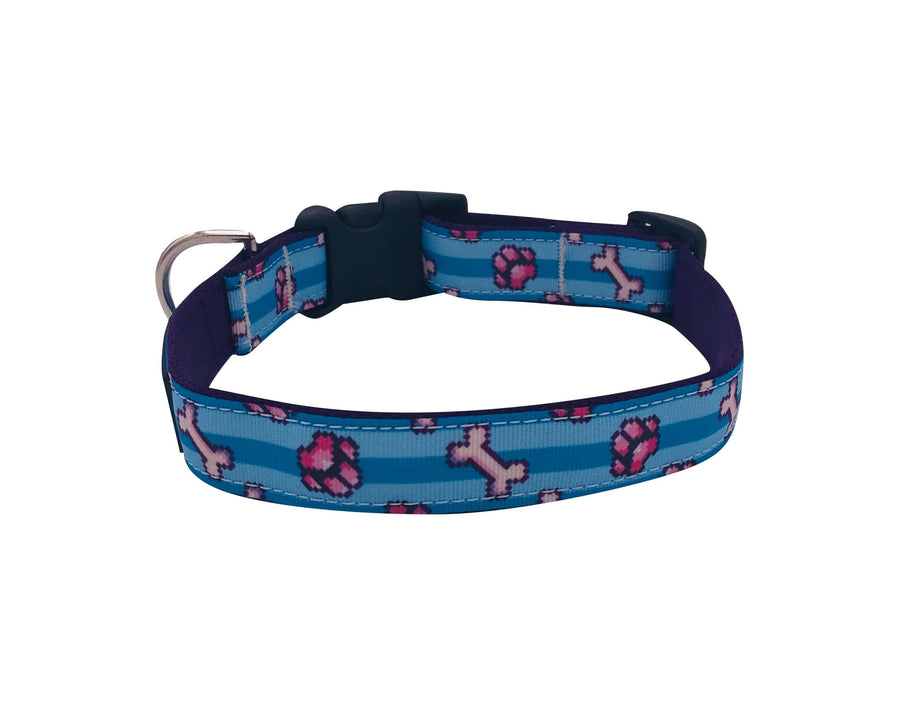 Pixel Paws Collar featuring pink paw prints and bones on blue background, with quick release buckle and D ring.