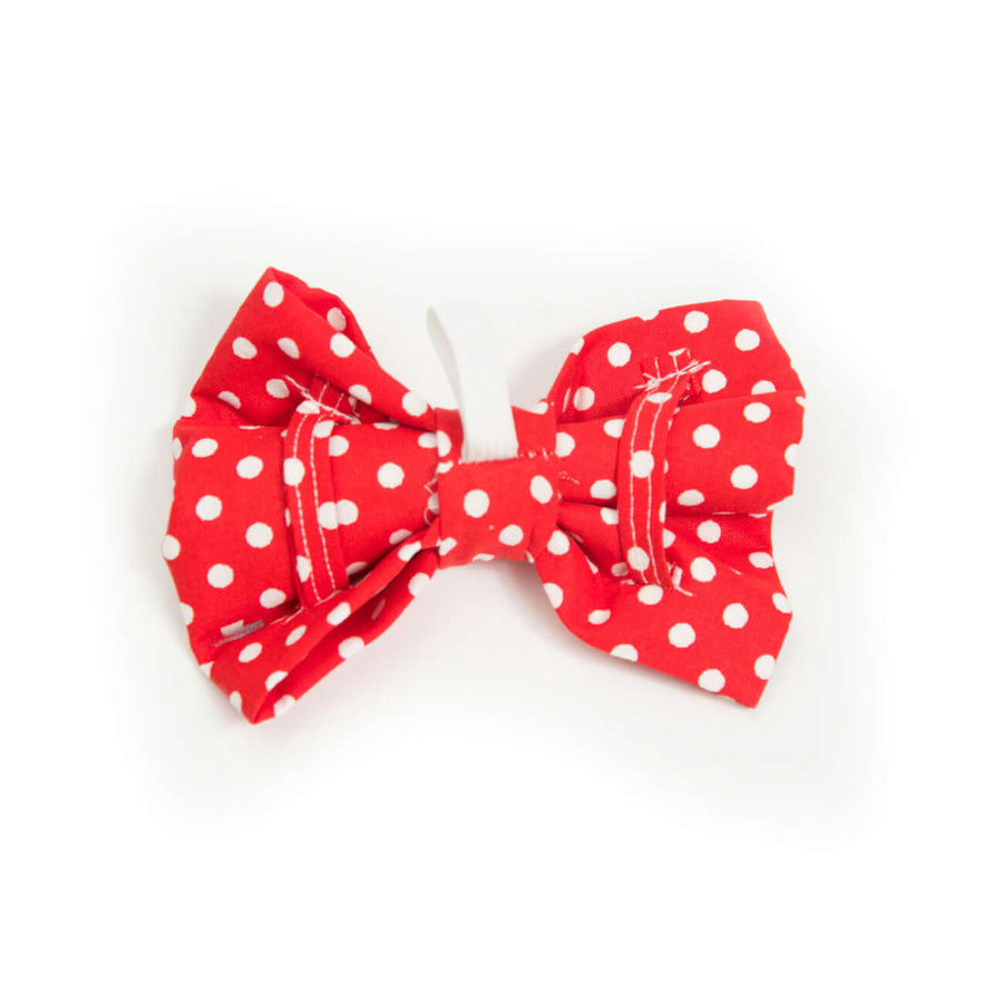 Red Polka Dot Bowtie for dogs, featuring a unique polka dot pattern and easy slip-on design for collars.