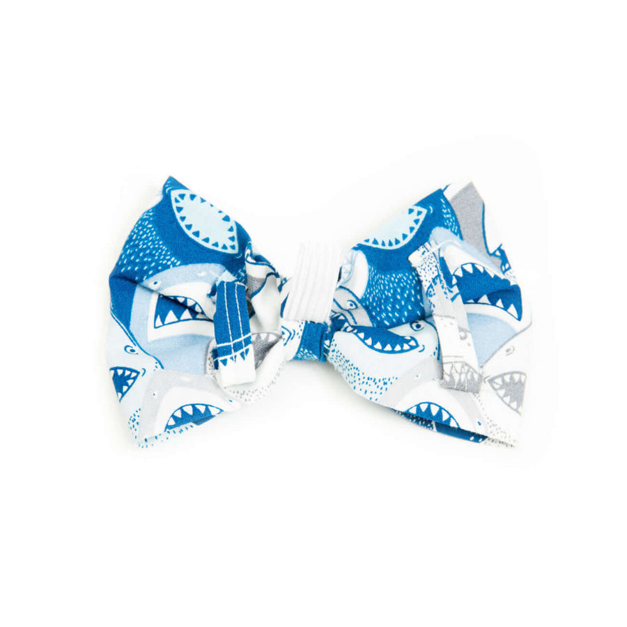 Shark Attack Bowtie featuring a playful shark pattern, designed for dogs with elastic collar attachment.
